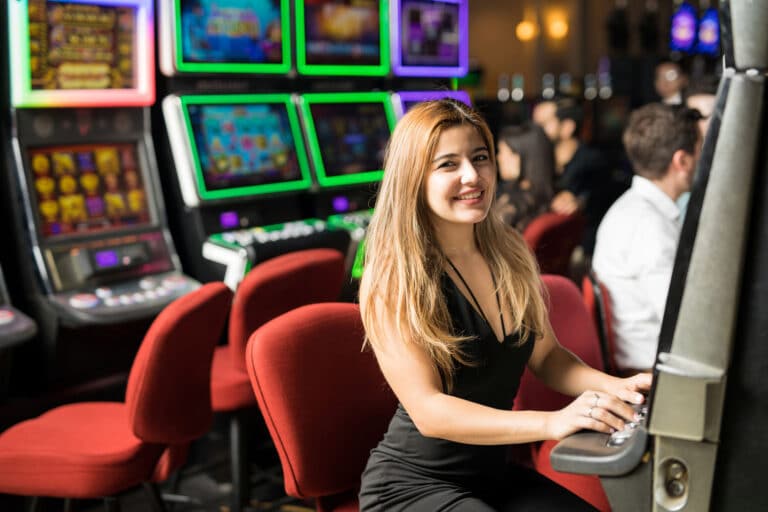 Women in a black dress playing slots